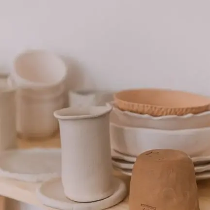 Sofia's studio shelf with drying cups and plates